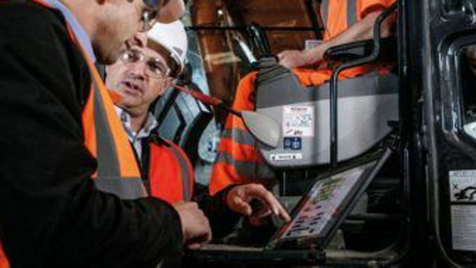 Contractor using technology and digital tools on a job site